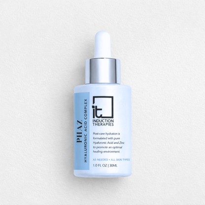 Induction Therapies skincare bottle on white background